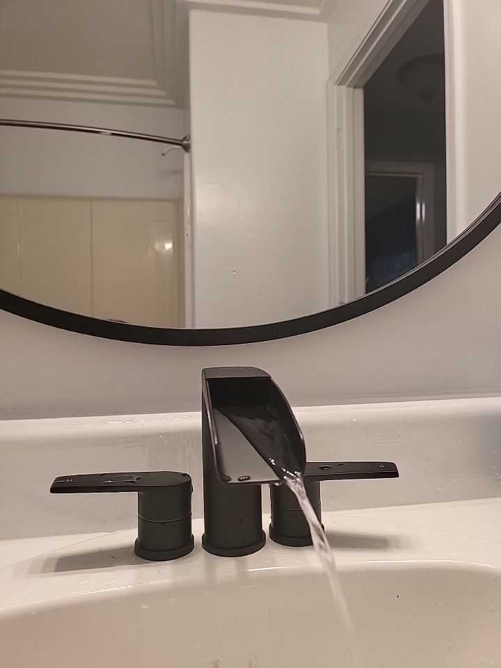 Modern black bathroom faucet installed by Honey Bee Plumbing