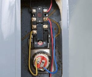 Electric water heater with exposed element and thermostat