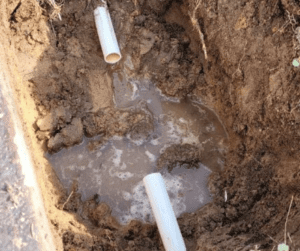 PVC Water Main Repair in Pensacola, FL - Honey Bee Plumbing PVC Water Main with Section Cut Out