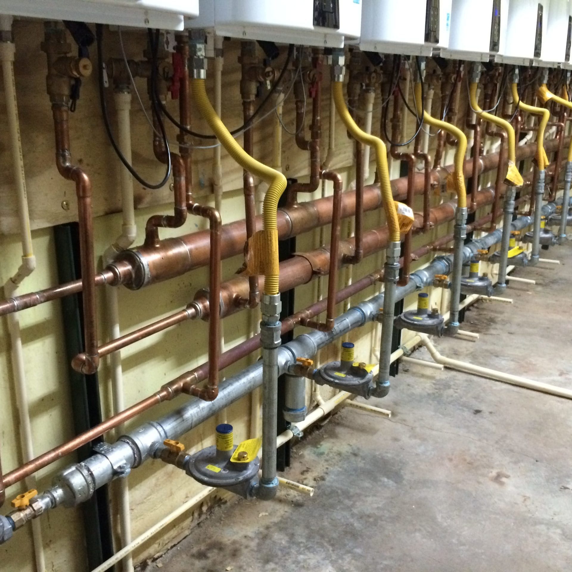 Superior Performance: Cascading Navien 240A Tankless Water Heater System Installed by Honey Bee Plumbing Image of a cascading Navien 240A tankless water heater system designed and installed by Honey Bee Plumbing owner and founder, Robert A. Skechak III